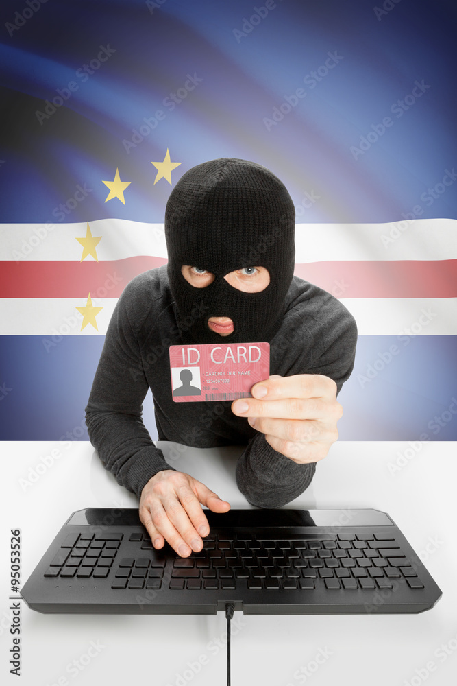 Hacker with flag on background holding ID card in hand - Cape Verde Hacker with flag on background holding ID card in hand - Cape Verde