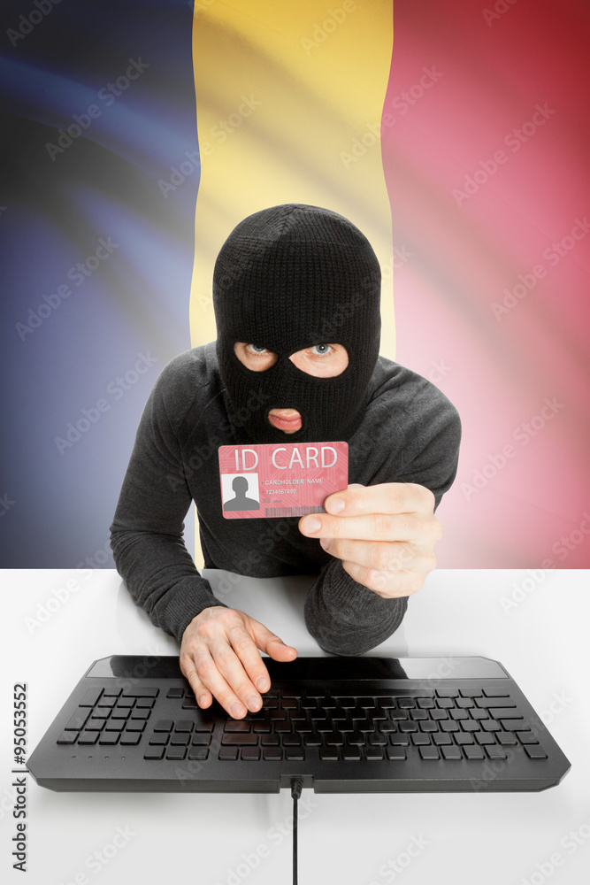 Hacker with flag on background holding ID card in hand - Chad Hacker with flag on background holding ID card in hand - Chad