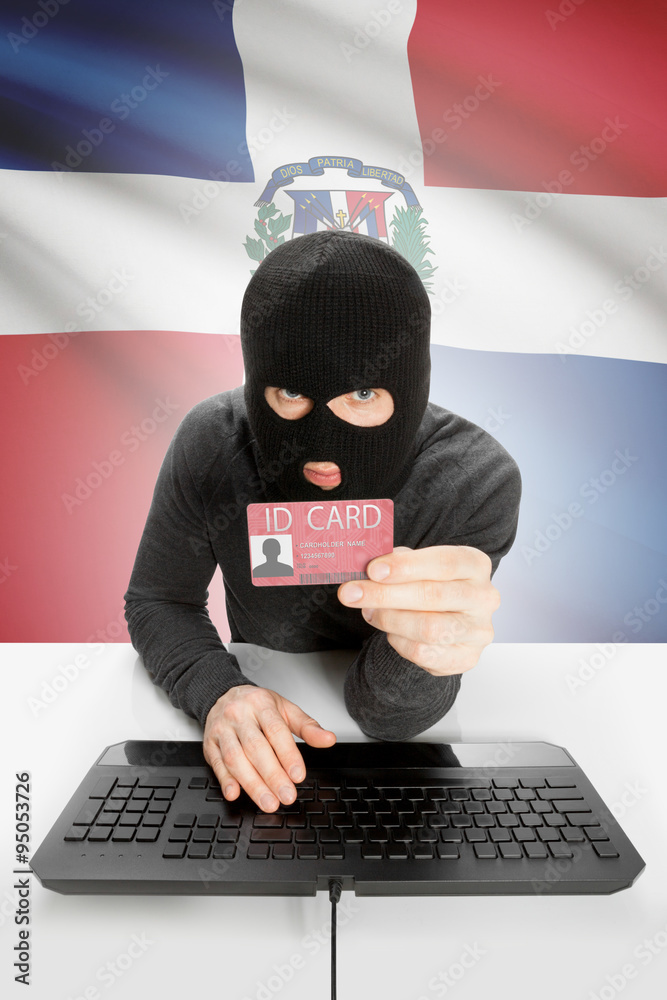 Hacker with flag on background holding ID card in hand - Dominican Republic Hacker with flag on background holding ID card in hand - Dominican Republic