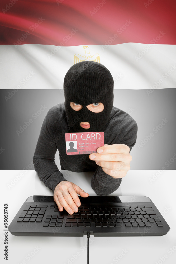 Hacker with flag on background holding ID card in hand - Egypt Hacker with flag on background holding ID card in hand - Egypt