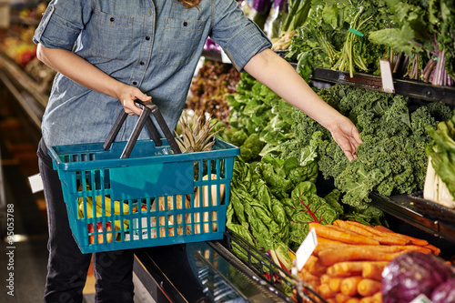 a woman shopping at a grocery store