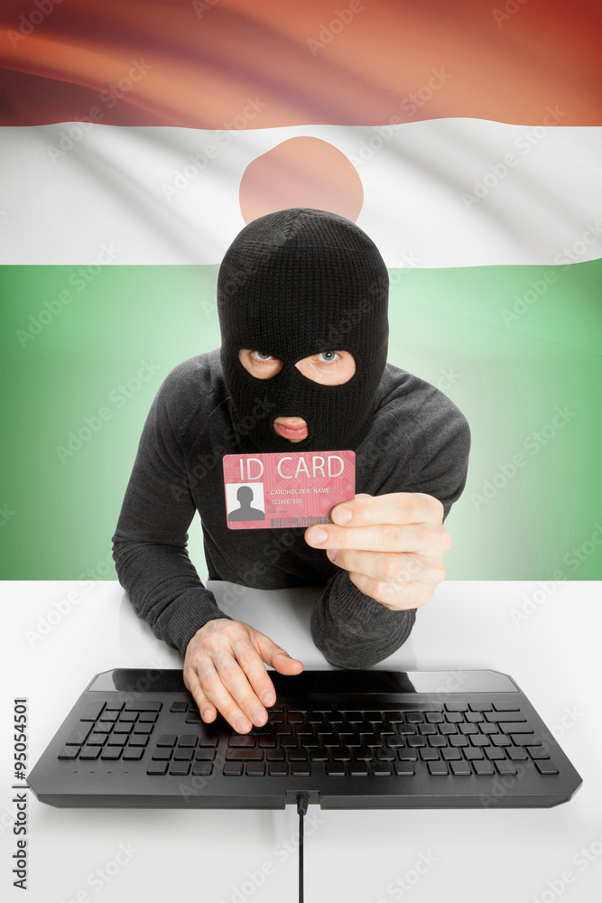 Hacker with flag on background holding ID card in hand - Niger Hacker with flag on background holding ID card in hand - Niger
