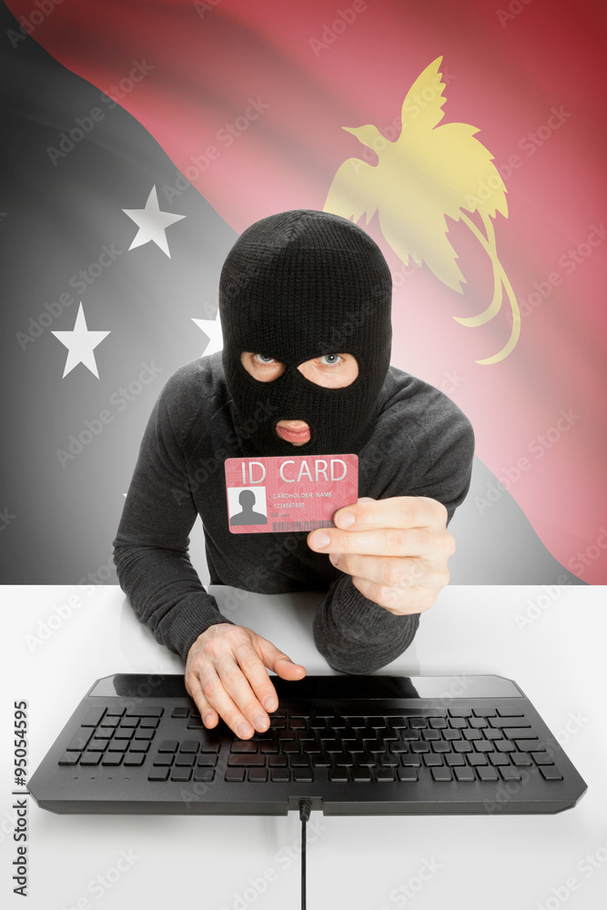 Hacker with flag on background holding ID card in hand - Papua New Guinea
