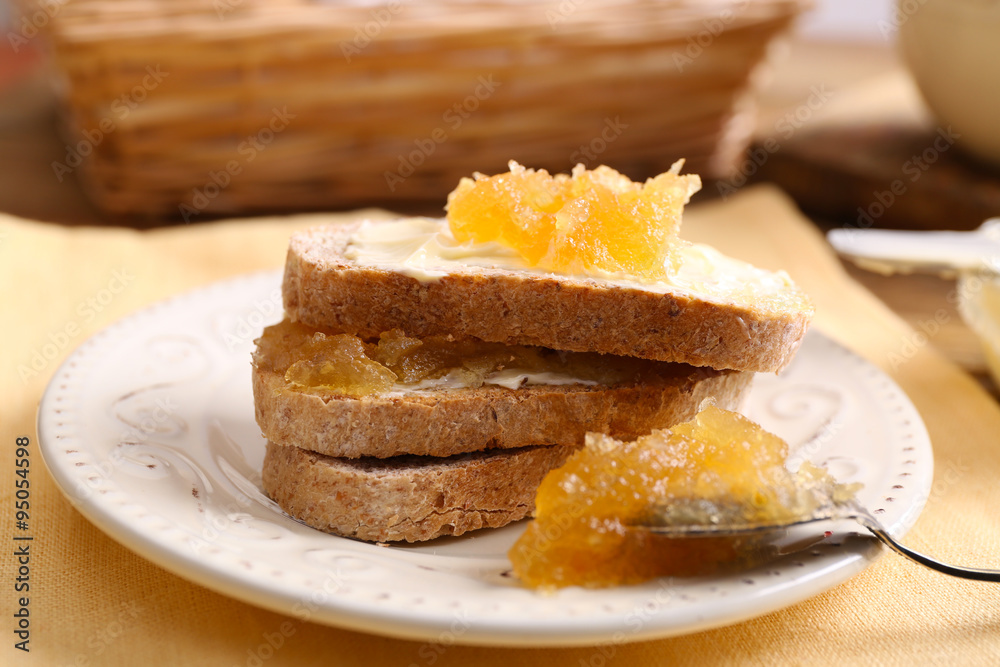 Fresh toast with butter and jam on table close up Fresh toast with butter and jam on table close up