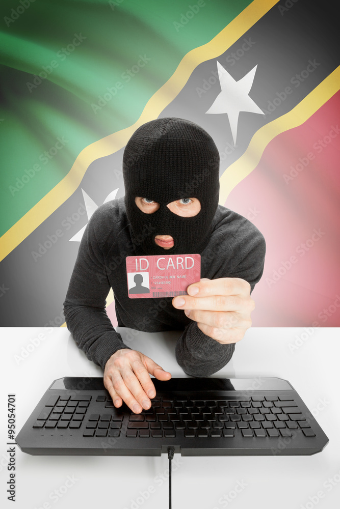 Hacker with flag on background holding ID card in hand - Saint Kitts and Nevis Hacker with flag on background holding ID card in hand - Saint Kitts and Nevis