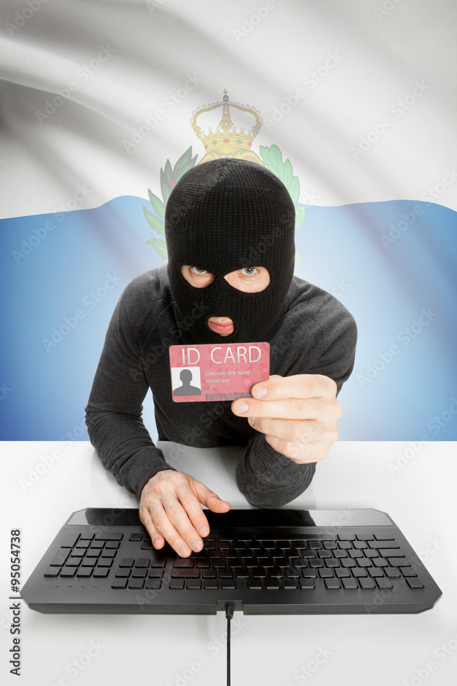 Hacker with flag on background holding ID card in hand - San Marino Hacker with flag on background holding ID card in hand - San Marino