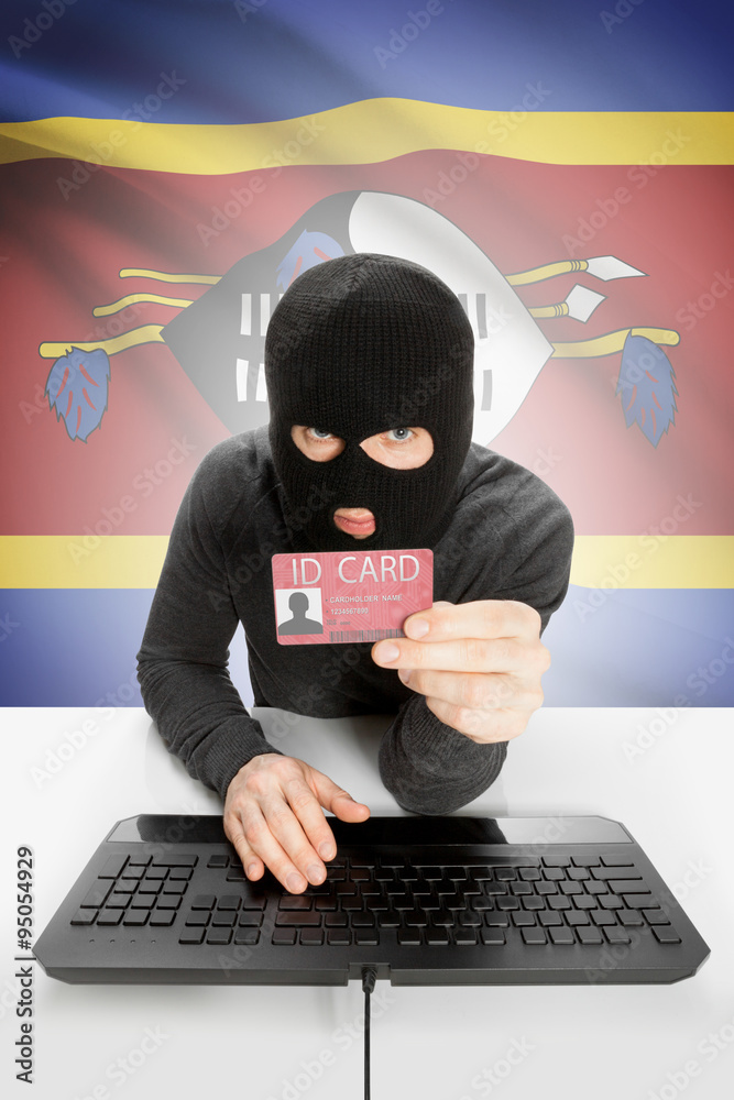 Hacker with flag on background holding ID card in hand - Swaziland Hacker with flag on background holding ID card in hand - Swaziland