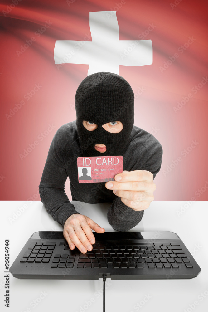 Hacker with flag on background holding ID card in hand - Switzerland Hacker with flag on background holding ID card in hand - Switzerland