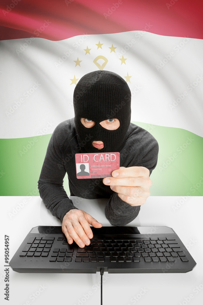 Hacker with flag on background holding ID card in hand - Tajikistan Hacker with flag on background holding ID card in hand - Tajikistan