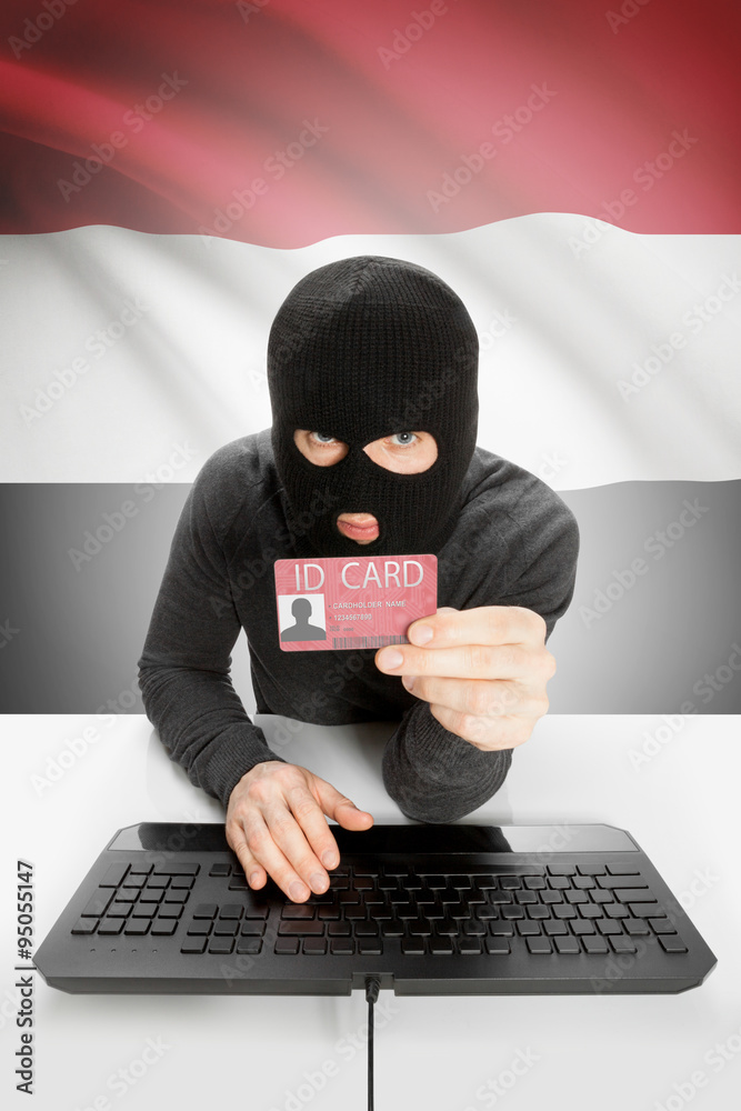 Hacker with flag on background holding ID card in hand - Yemen Hacker with flag on background holding ID card in hand - Yemen