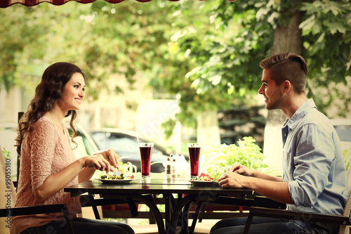 happy couple eating at terrace