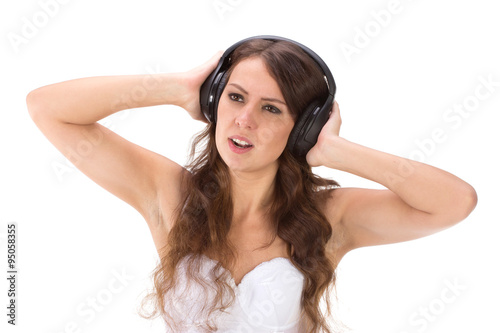 Attractive Sexy woman with beautiful body posing with headphones