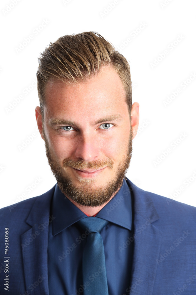 A handsome businessman in his 20s standing looking at camera with a white background. Wearing a blue suit and blue tie. A handsome businessman in his 20s standing looking at camera with a white background. Wearing a blue suit and blue tie.
