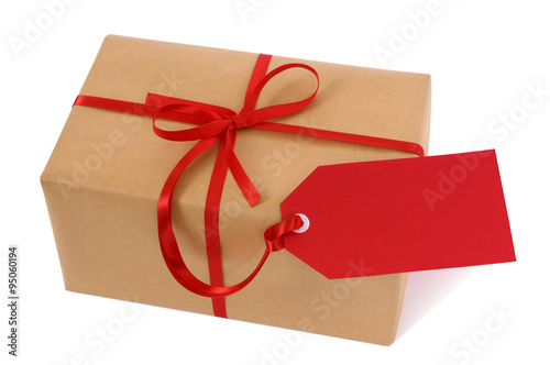 Wallpaper Mural Brown paper package parcel or present one single small tied with red ribbon and gift tag for christmas birthday or valentine isolated on white background photo Torontodigital.ca