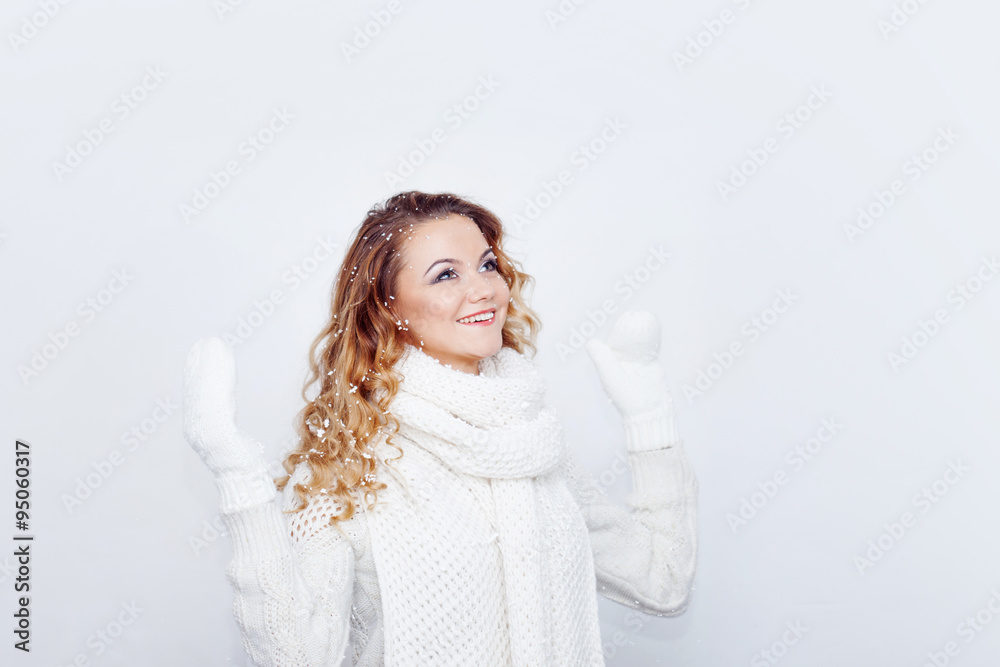 Woman in warm knitted scarf and gloves, portrait on white background, place for your text Woman in warm knitted scarf and gloves, portrait on white background, place for your text