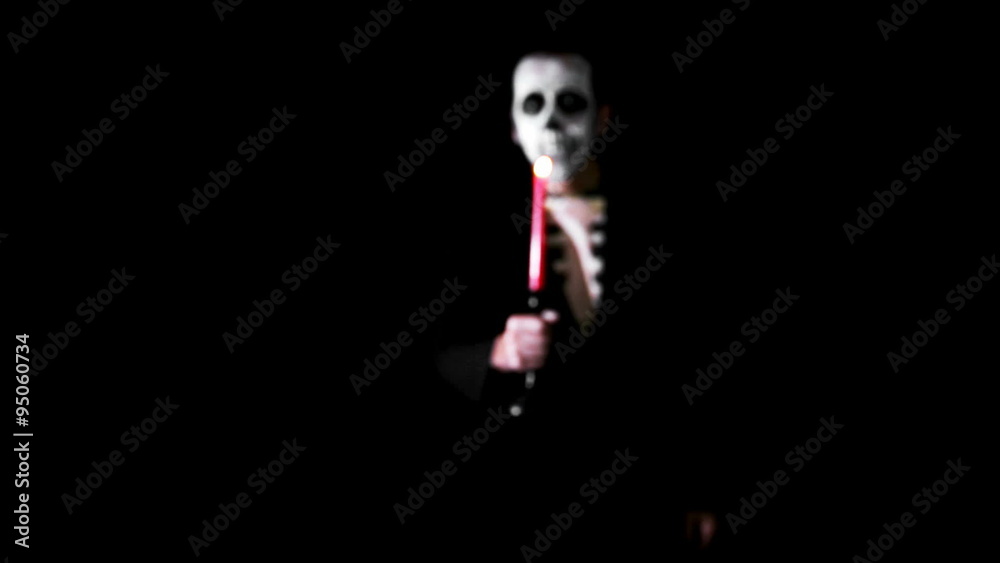sugar skull butler with candle is walking through the room sugar skull butler with candle is walking through the room