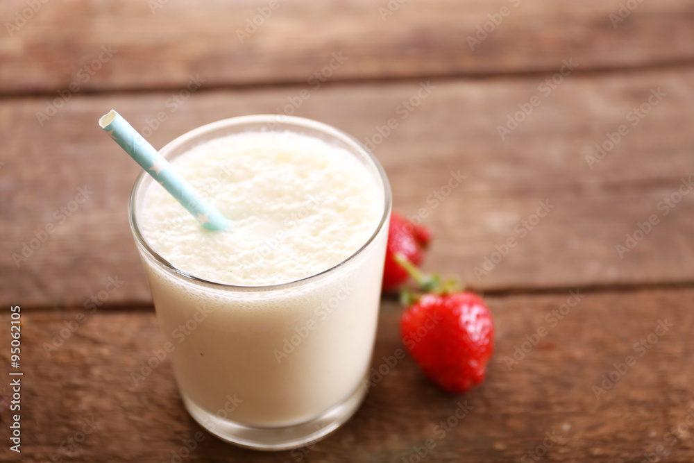 Fresh yogurt with strawberry on wooden background Fresh yogurt with strawberry on wooden background