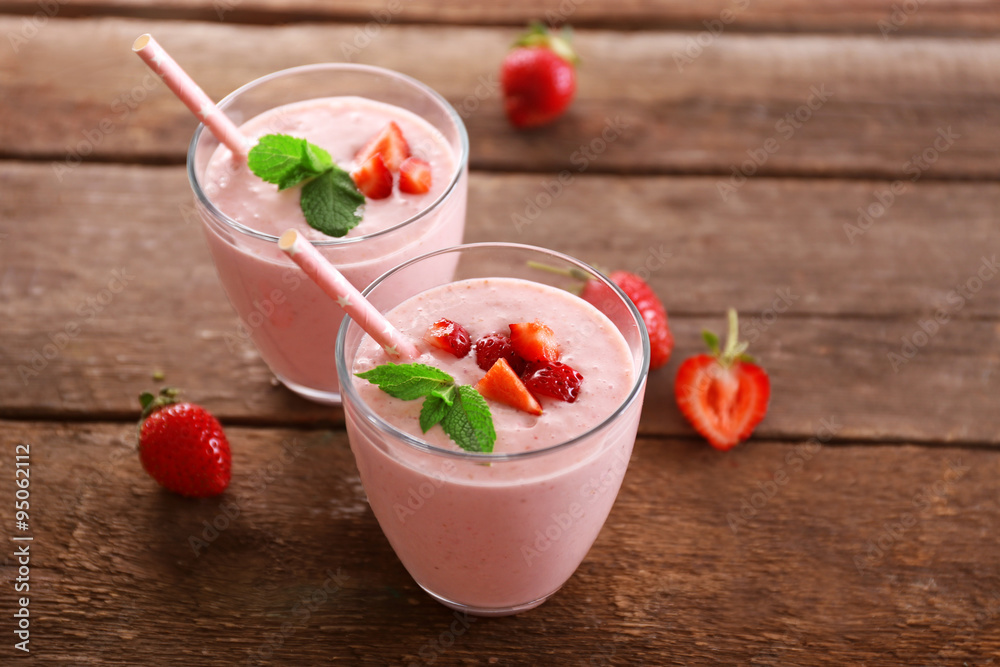 Fresh strawberry yogurt with berries around on wooden background Fresh strawberry yogurt with berries around on wooden background