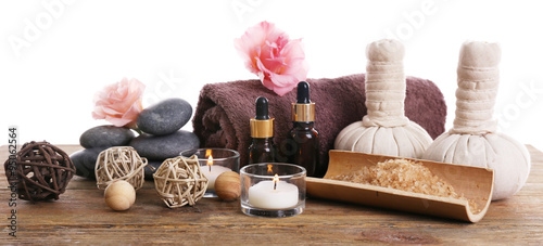 Beautiful spa set on wooden table against white background