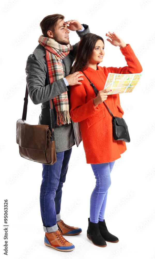 A pair of happy tourists sightseeing in spring/autumn, isolated on white A pair of happy tourists sightseeing in spring/autumn, isolated on white