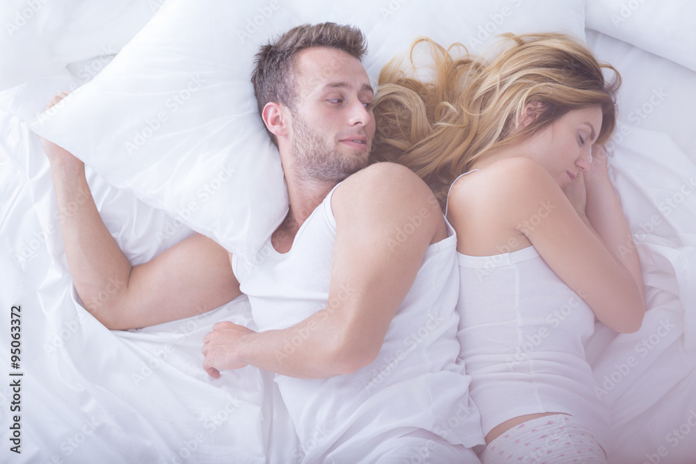 Sleeping woman and awaken man Sleeping woman and awaken man