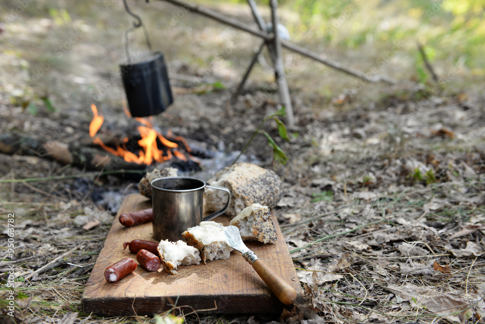 Grilled sausages on cutting board in the wood Grilled sausages on cutting board in the wood