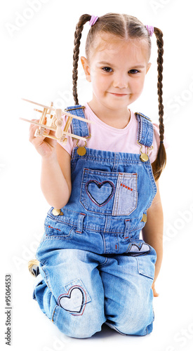 Beautiful little girl plays...