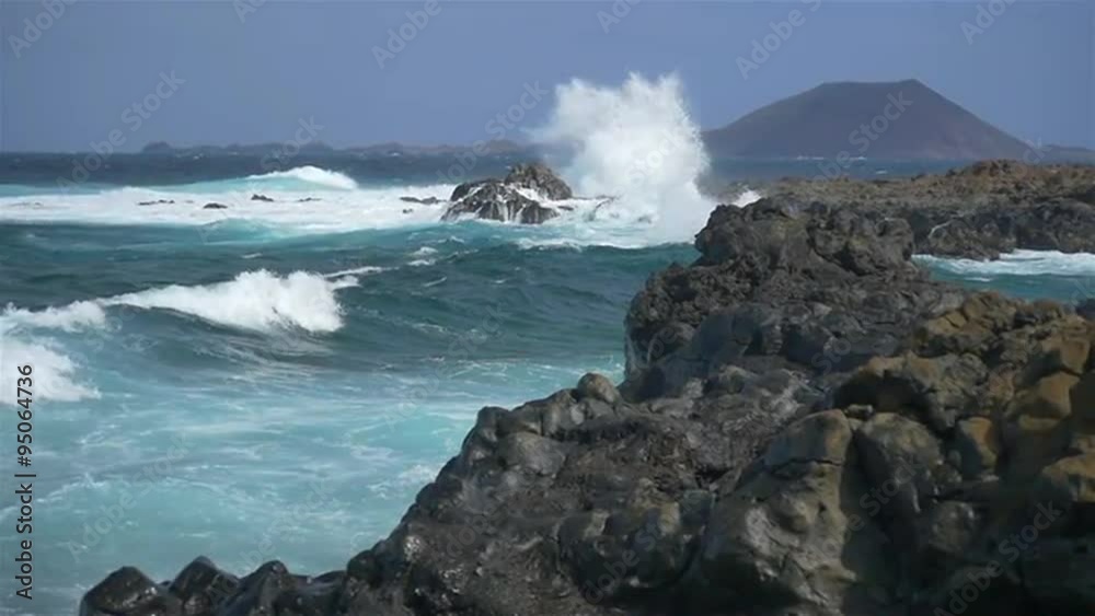 SLOW MOTION: Huge waves splashing into the rocks SLOW MOTION: Huge waves splashing into the rocks