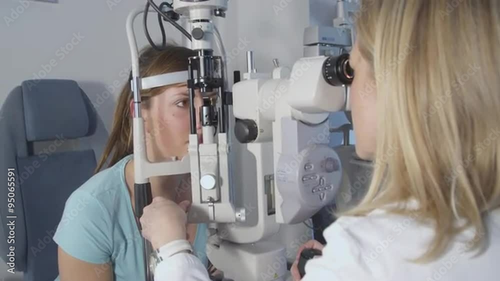 Female patient on medical attendance at the optometrist Female patient on medical attendance at the optometrist