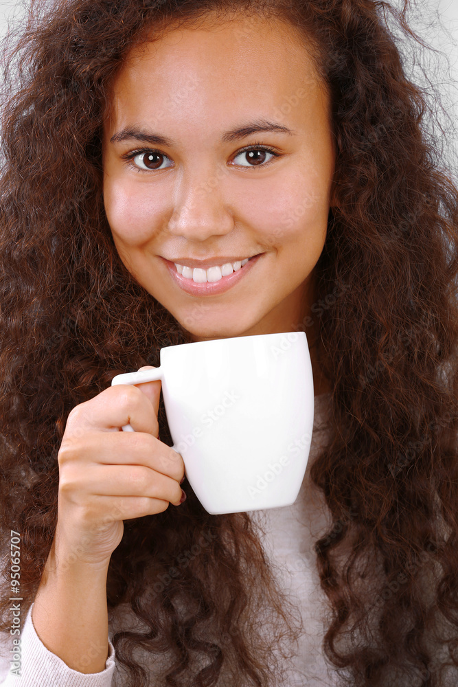 Pretty young woman drinking coffee, close up Pretty young woman drinking coffee, close up