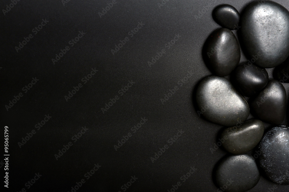Fototapeta premium Spa stones on black background