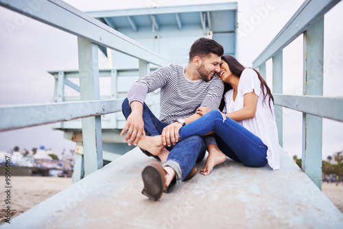 loving romantic hispanic couple snuggling with each other neaer santa monica