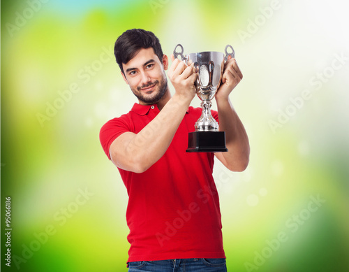 man celebrating with trophy