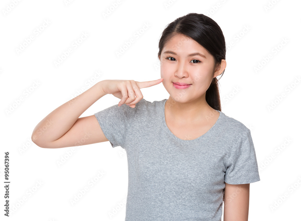 Asian woman finger point to her teeth Asian woman finger point to her teeth