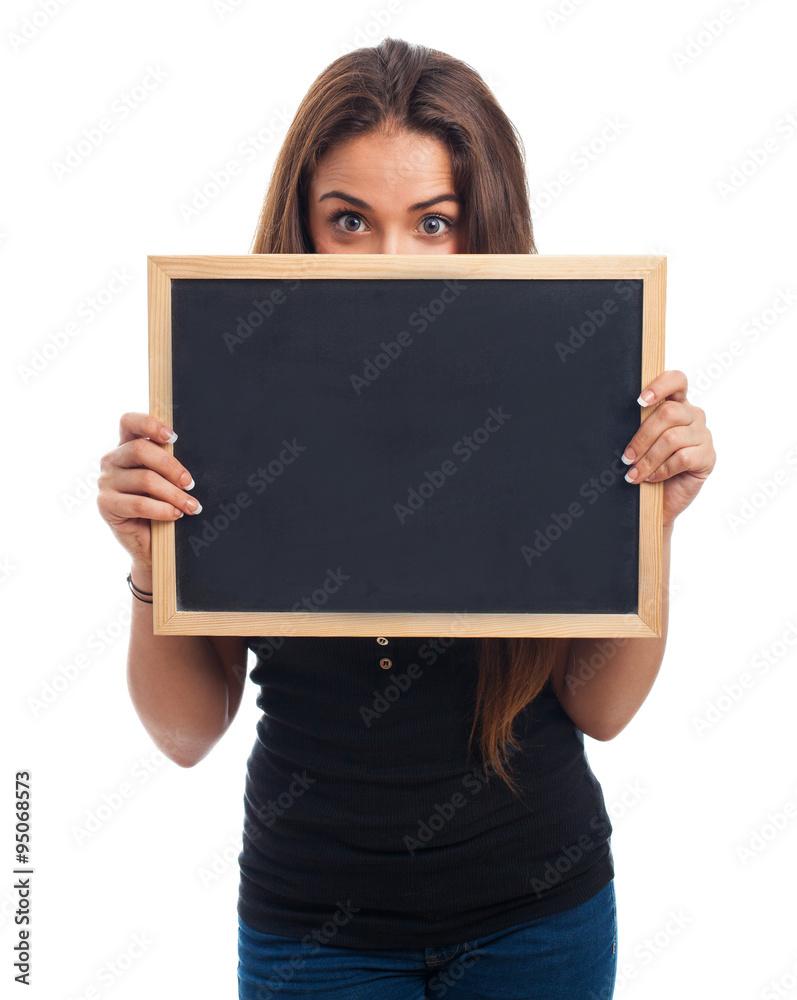 portrait of a young student hidden behind a chalkboard portrait of a young student hidden behind a chalkboard