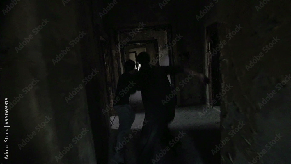SLOW MOTION: Free runners running through abandoned house