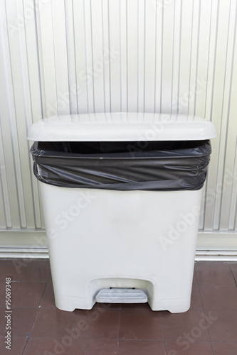 black bag plastic in white trashcan bin