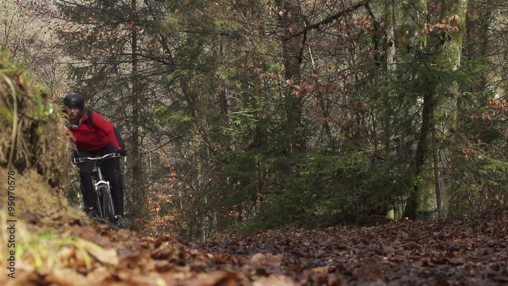 SLOW MOTION: Mountain biker braking in a turn