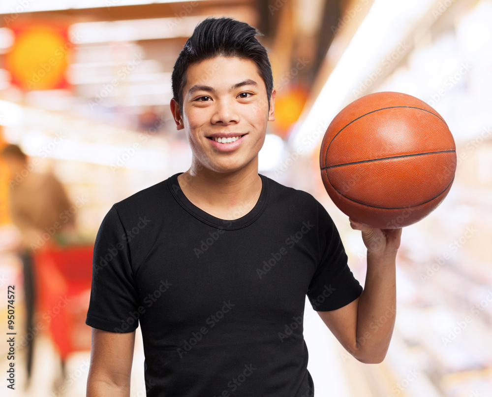 happy chinese sport man with basket ball happy chinese sport man with basket ball