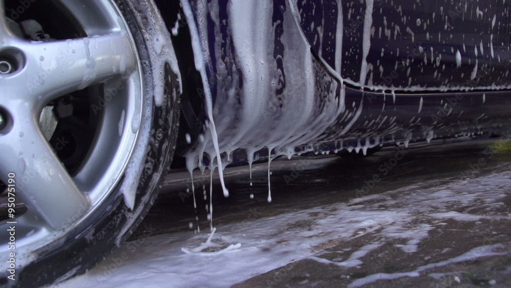 SLOW MOTION: Hand washing a car