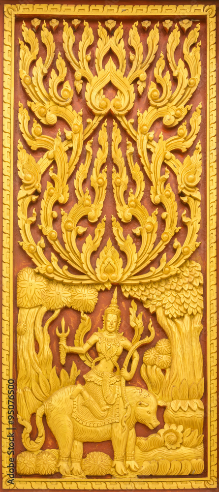 Thai wooden statues on the Thai church's window