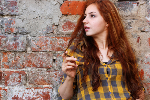 red-haired girl in a hat hipster