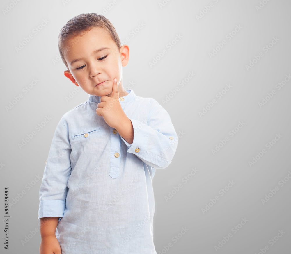 portrait of a little boy thinking and serius portrait of a little boy thinking and serius