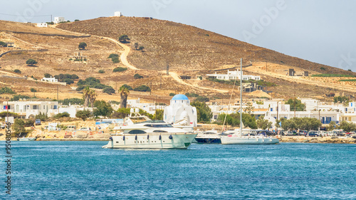 Antiparos port in Greece with a traditional white church standing in the middle.
 photo