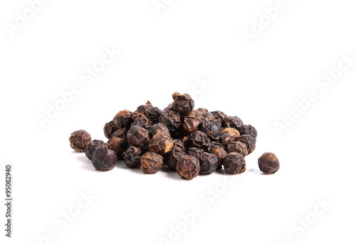 Black pepper on white background photo