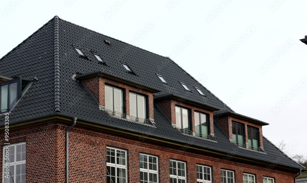 the roof of the house with nice window.