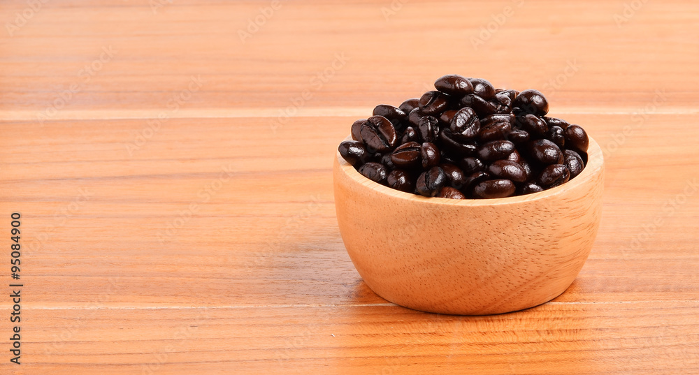 Coffee beans on wooden background Coffee beans on wooden background