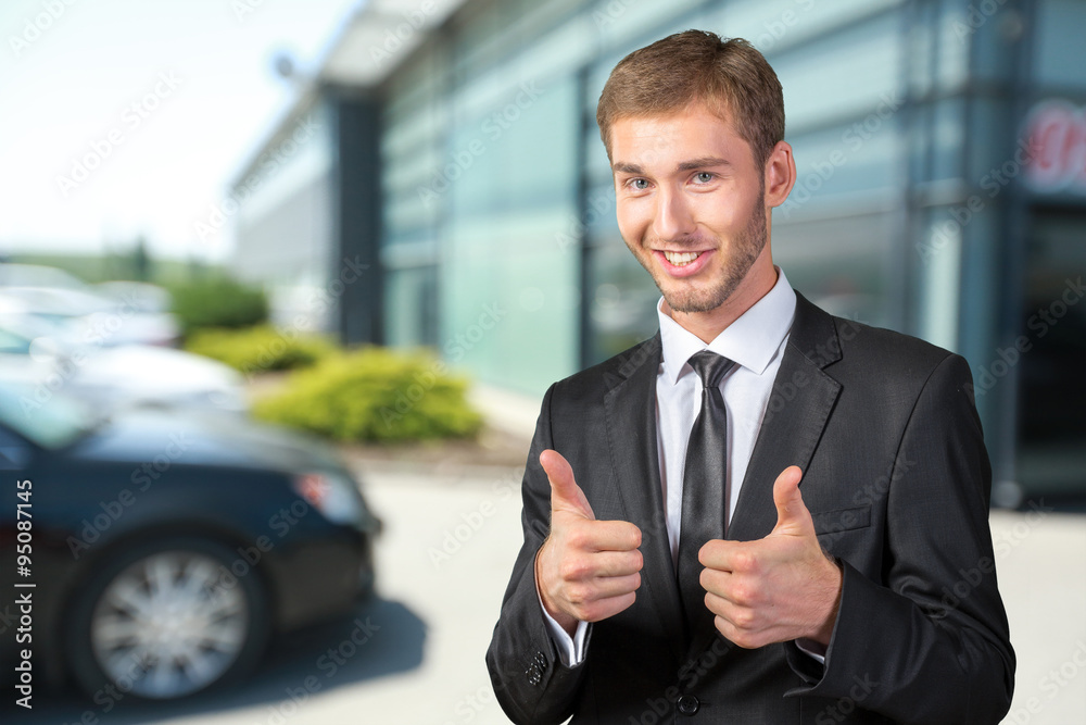 Young Businessman smiling and giving ok Young Businessman smiling and giving ok