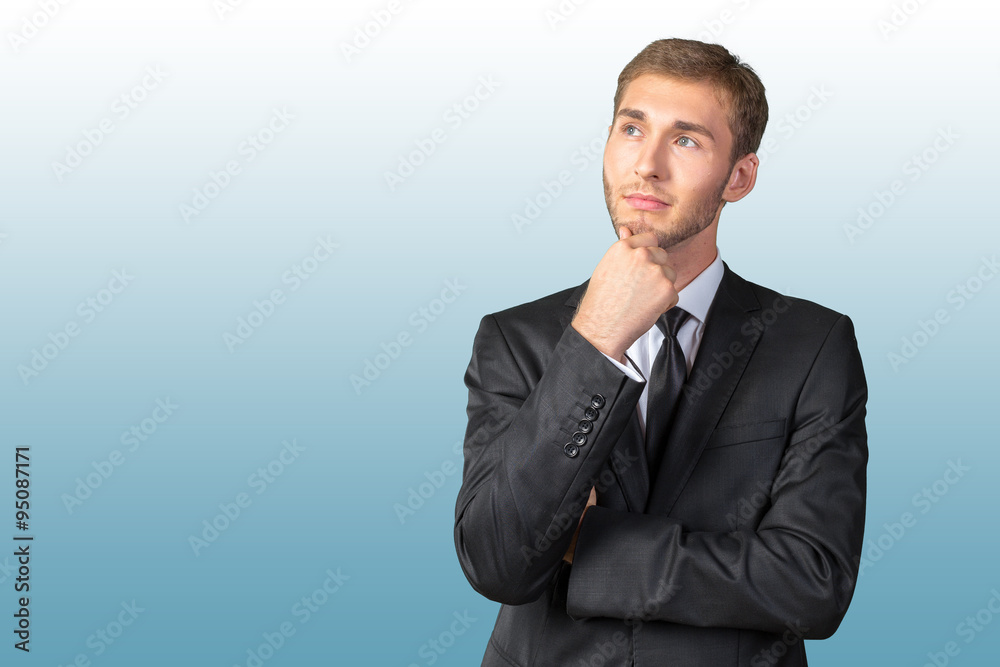 Confused young businessman thinking Confused young businessman thinking