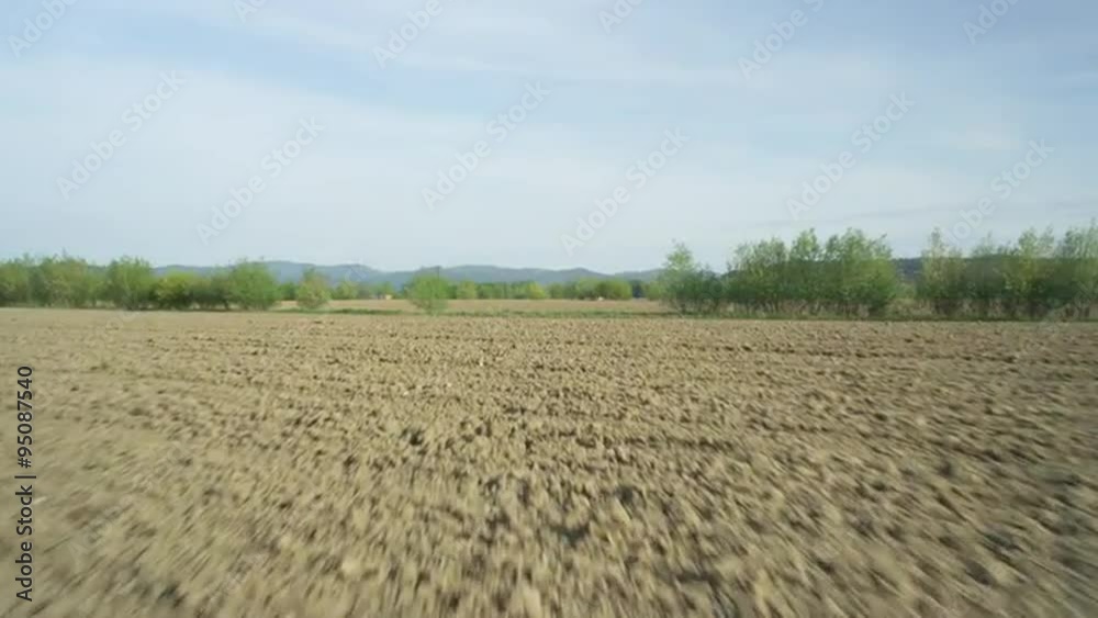 AERIAL: Flying over plowed fields in early spring AERIAL: Flying over plowed fields in early spring